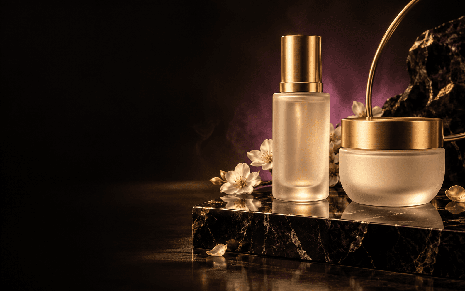 Gold packaging forms — boxes and a jar — arranged on a reflective shelf under a plum glow.